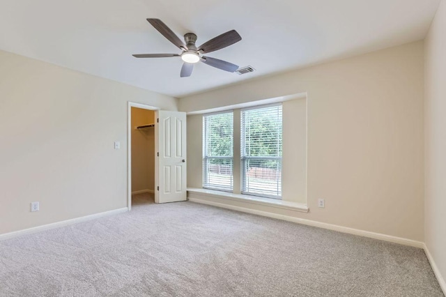 409 S Frontier Ln, Cedar Park, TX 78613 - unfurnished bedroom featuring carpet, baseboards, a spacious closet, and a ceiling fan