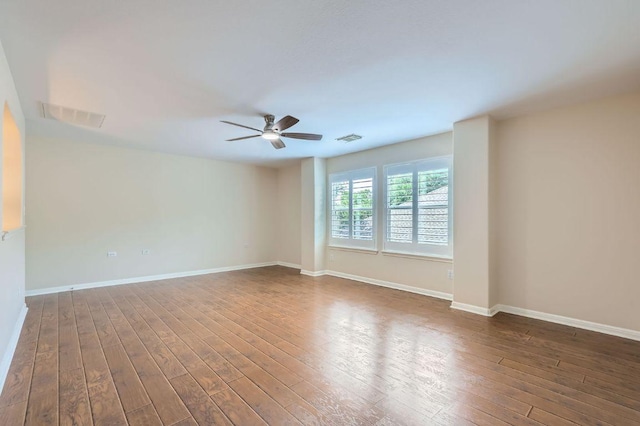 409 S Frontier Ln, Cedar Park, TX 78613 - unfurnished room with a ceiling fan, dark wood finished floors, and baseboards