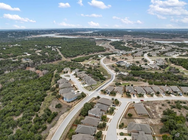 aerial view of property and surrounding area featuring nearby suburban area