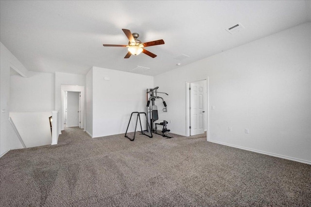 workout area featuring ceiling fan and carpet flooring