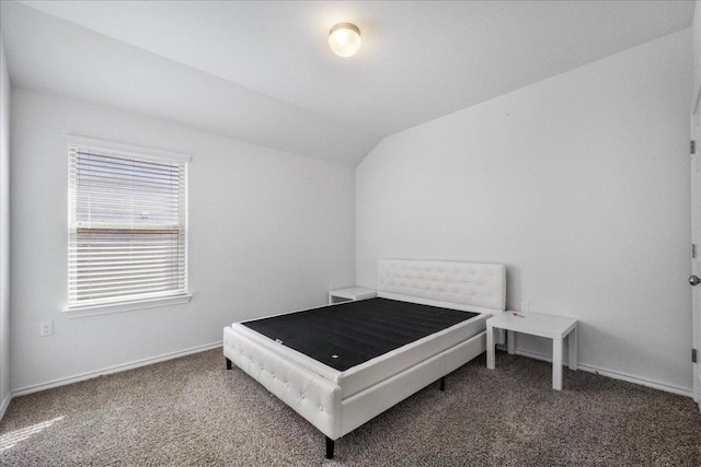 bedroom featuring carpet, vaulted ceiling, and baseboards