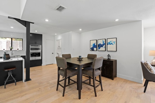3305 Eldorado Trl, Austin, TX 78748 - dining room with light wood finished floors, recessed lighting, and baseboards