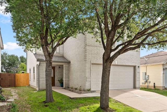 view of front facade with brick siding, driveway, fence, a garage, and a shingled roof