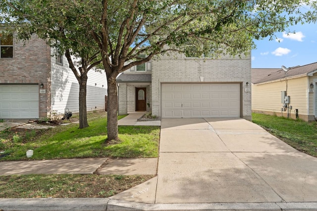 view of front of property featuring brick siding, driveway, and a front lawn