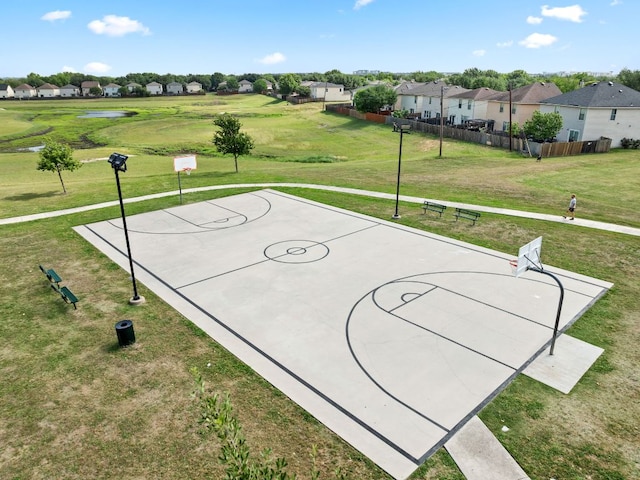 view of basketball court featuring community basketball court and a residential view