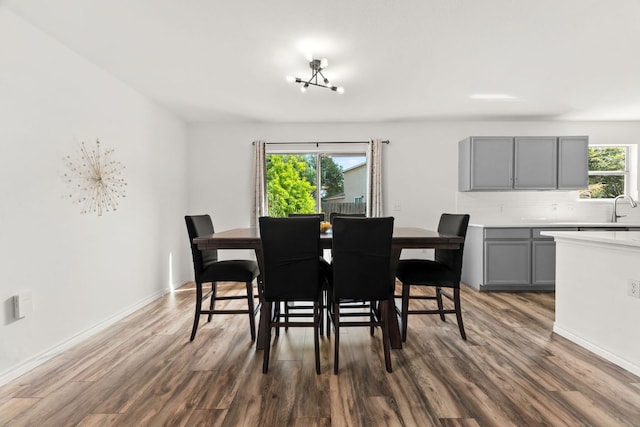 dining room with dark wood finished floors and baseboards