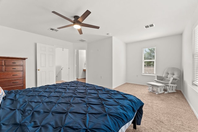carpeted bedroom with a ceiling fan and baseboards