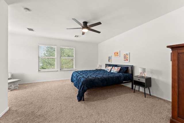 bedroom with light carpet, baseboards, and ceiling fan