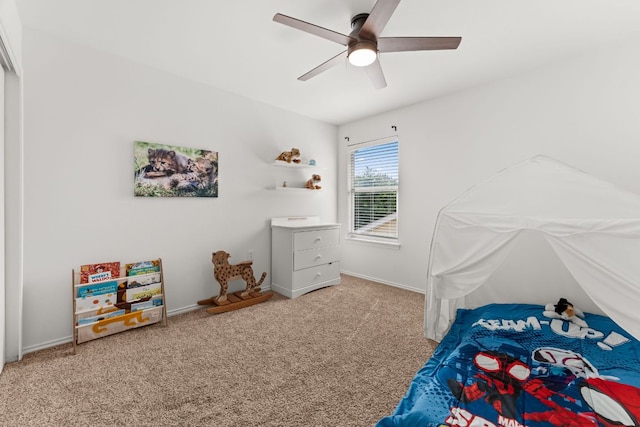 bedroom with carpet flooring, a ceiling fan, and baseboards
