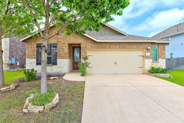 801 Vaughn St, Georgetown, TX 78628 - view of front of house with stone siding, concrete driveway, an attached garage, fence, and board and batten siding