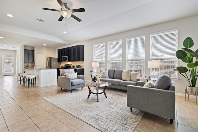 801 Vaughn St, Georgetown, TX 78628 - living room featuring light tile patterned flooring, healthy amount of natural light, ceiling fan, recessed lighting, and baseboards