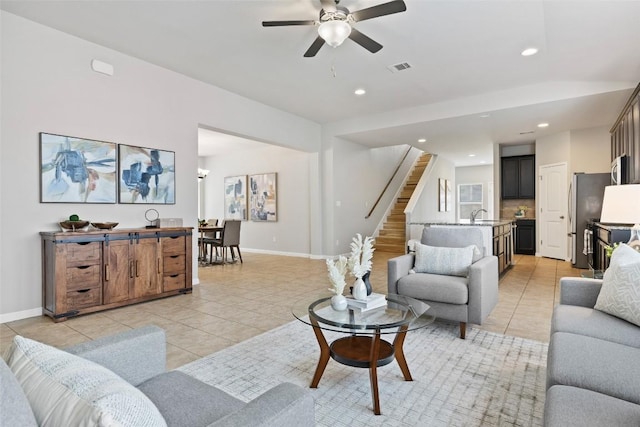 801 Vaughn St, Georgetown, TX 78628 - living area with light tile patterned floors, stairs, ceiling fan, baseboards, and recessed lighting