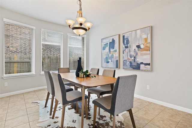 801 Vaughn St, Georgetown, TX 78628 - dining area with a chandelier, light tile patterned floors, and baseboards