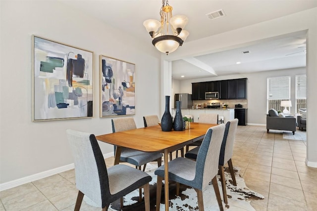 801 Vaughn St, Georgetown, TX 78628 - dining area featuring light tile patterned floors, a chandelier, baseboards, and recessed lighting