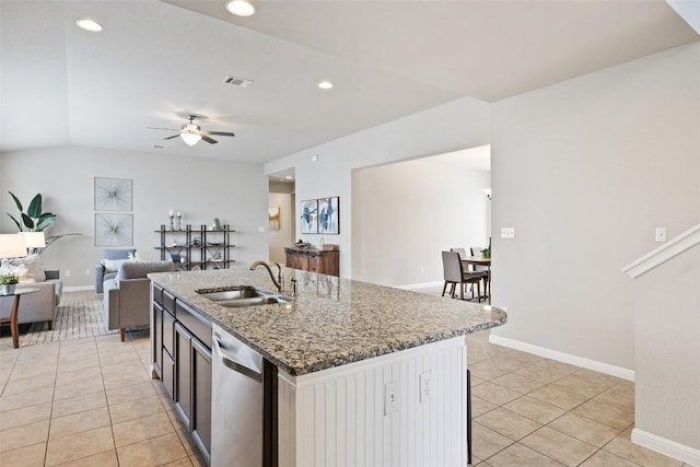 801 Vaughn St, Georgetown, TX 78628 - kitchen featuring a sink, stainless steel dishwasher, light tile patterned floors, ceiling fan, and stone counters