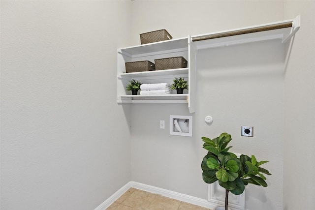 801 Vaughn St, Georgetown, TX 78628 - washroom with hookup for an electric dryer, hookup for a washing machine, gas dryer hookup, baseboards, and light tile patterned flooring