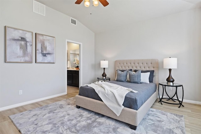 801 Vaughn St, Georgetown, TX 78628 - bedroom with lofted ceiling, light wood-style flooring, baseboards, connected bathroom, and ceiling fan