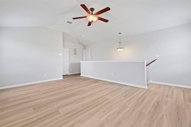 801 Vaughn St, Georgetown, TX 78628 - unfurnished living room featuring a ceiling fan, lofted ceiling, light wood finished floors, and baseboards