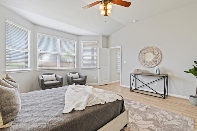 801 Vaughn St, Georgetown, TX 78628 - bedroom with multiple windows, wood finished floors, vaulted ceiling, baseboards, and a ceiling fan