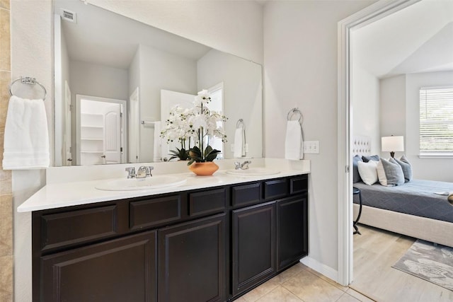 801 Vaughn St, Georgetown, TX 78628 - full bathroom featuring double vanity and ensuite bath