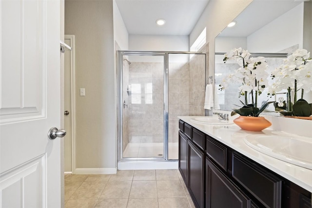 801 Vaughn St, Georgetown, TX 78628 - bathroom with a stall shower, tile patterned floors, and double vanity