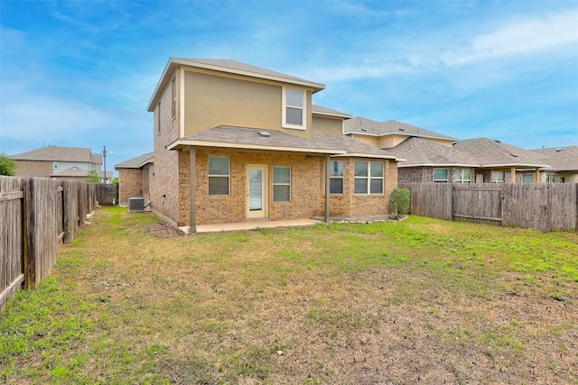 801 Vaughn St, Georgetown, TX 78628 - rear view of property with a patio area and brick siding