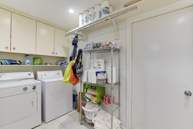 3409 Sanderling Trl, Austin, TX 78746 - washroom with washer and dryer, cabinet space, and light tile patterned floors