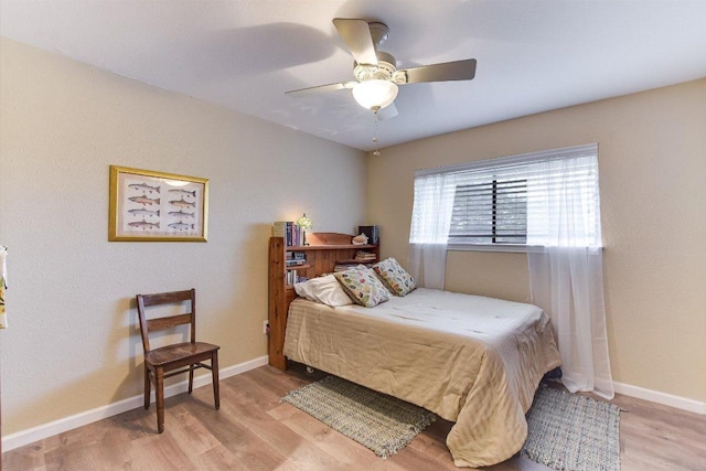 3409 Sanderling Trl, Austin, TX 78746 - bedroom with wood finished floors, baseboards, and ceiling fan