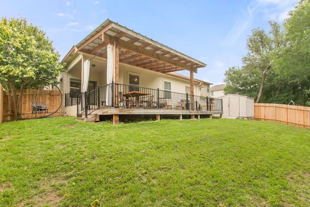 back of house with a shed, an outdoor structure, and a wooden deck