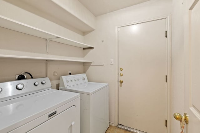 clothes washing area with separate washer and dryer