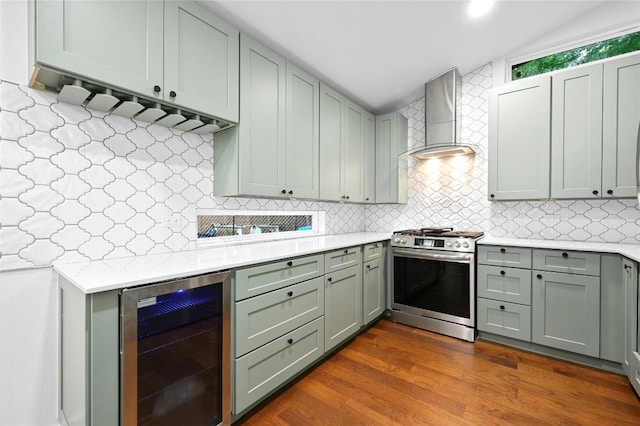 1006 Cherico St, Austin, TX 78702 - kitchen with wine cooler, stainless steel gas stove, wall chimney exhaust hood, light countertops, and tasteful backsplash