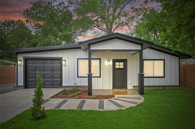 1006 Cherico St, Austin, TX 78702 - single story home featuring board and batten siding, a garage, and driveway