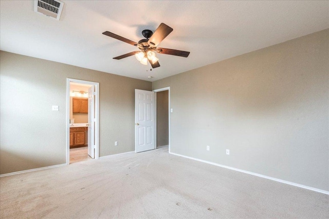 1713 Lady Grey Ave, Pflugerville, TX 78660 - unfurnished bedroom featuring baseboards, light carpet, ensuite bath, and a ceiling fan