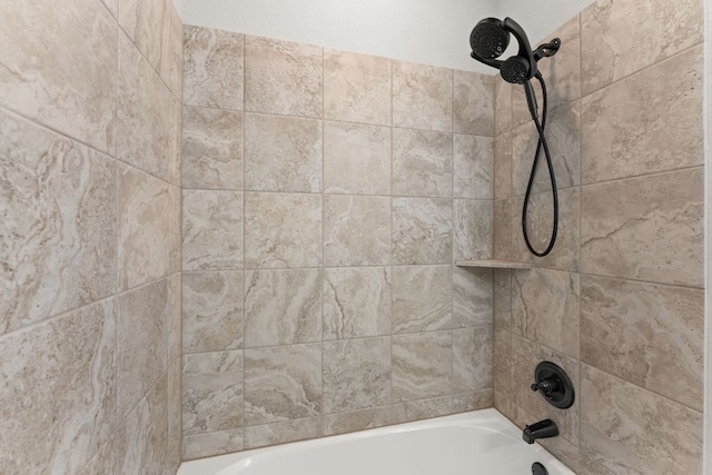 bathroom view of tub / shower combination