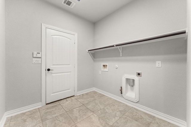 clothes washing area with hookup for a gas dryer, hookup for a washing machine, baseboards, and hookup for an electric dryer