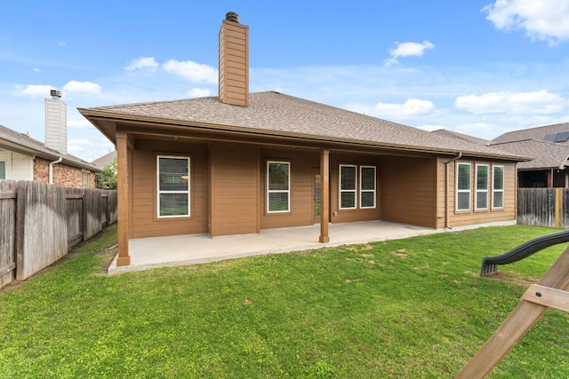 back of house featuring a patio and a chimney