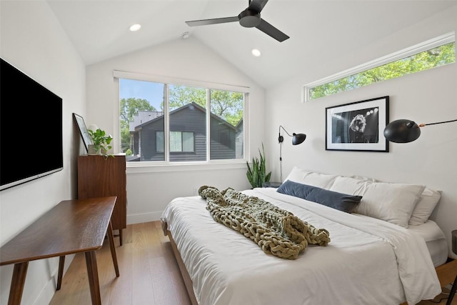 909 Mansell Ave Unit 2, Austin, TX 78702 - bedroom featuring wood finished floors, vaulted ceiling, baseboards, ceiling fan, and recessed lighting