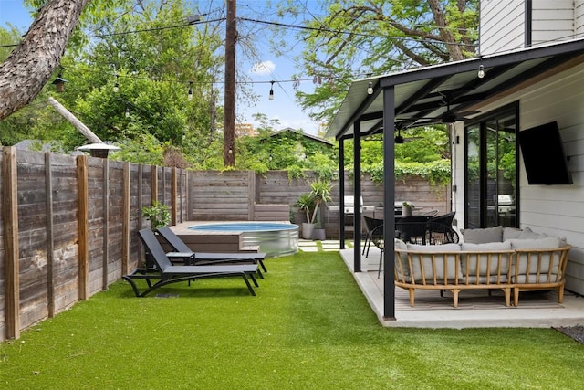 909 Mansell Ave Unit 2, Austin, TX 78702 - view of yard with an outdoor hangout area, a hot tub, and a patio