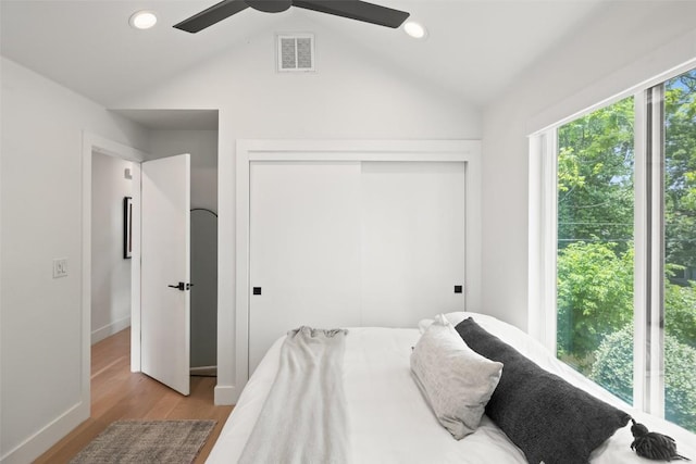 909 Mansell Ave Unit 2, Austin, TX 78702 - bedroom featuring vaulted ceiling, a closet, wood finished floors, baseboards, and a ceiling fan