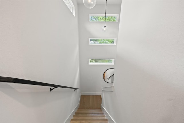 909 Mansell Ave Unit 2, Austin, TX 78702 - stairs featuring wood finished floors and baseboards