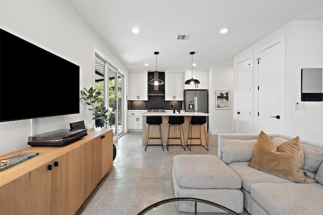 909 Mansell Ave Unit 2, Austin, TX 78702 - living area featuring concrete floors and recessed lighting