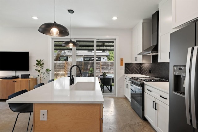 909 Mansell Ave Unit 2, Austin, TX 78702 - kitchen featuring stainless steel refrigerator with ice dispenser, range with gas stovetop, a sink, wall chimney exhaust hood, and concrete floors