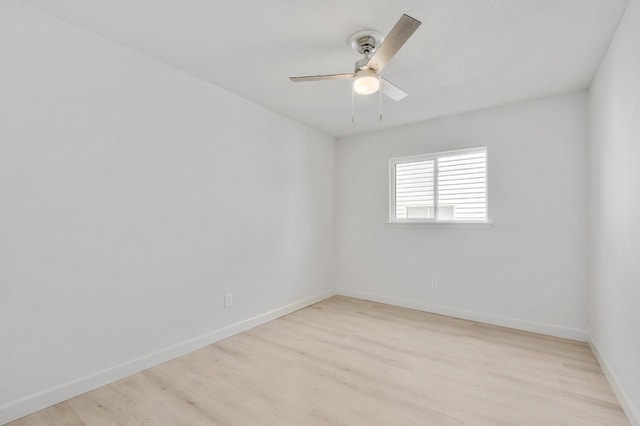 4011 Eskew Dr, Austin, TX 78749 - spare room with light wood-style flooring, a ceiling fan, and baseboards