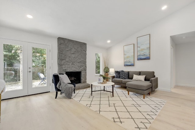 4011 Eskew Dr, Austin, TX 78749 - living area featuring french doors, light wood-style flooring, vaulted ceiling, recessed lighting, and baseboards
