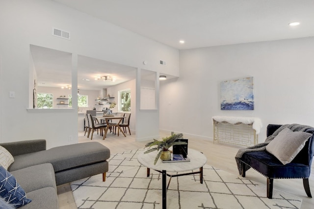 4011 Eskew Dr, Austin, TX 78749 - living area with light wood-type flooring, recessed lighting, and baseboards