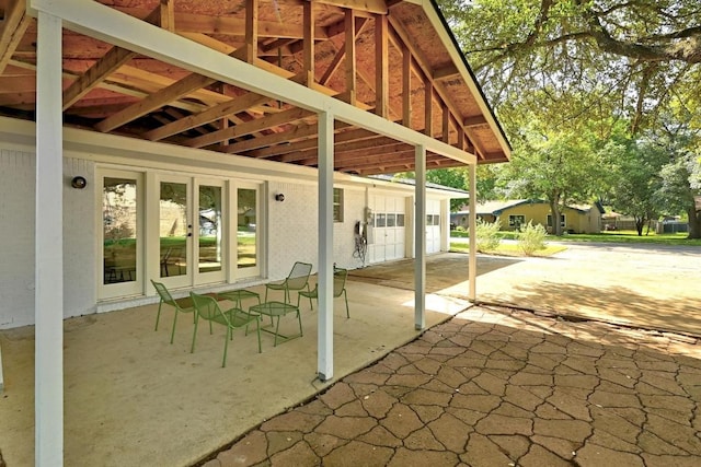 view of patio featuring driveway and french doors