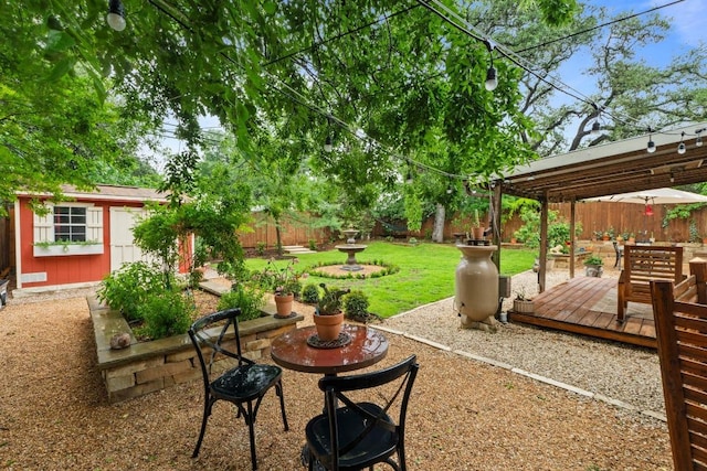2621 W 45th St, Austin, TX 78731 - fenced backyard featuring an outdoor structure and a wooden deck