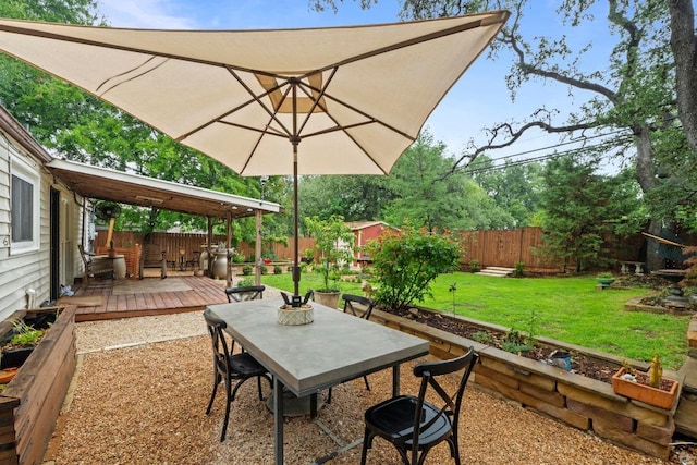 2621 W 45th St, Austin, TX 78731 - view of patio / terrace featuring a wooden deck, outdoor dining area, and a garden