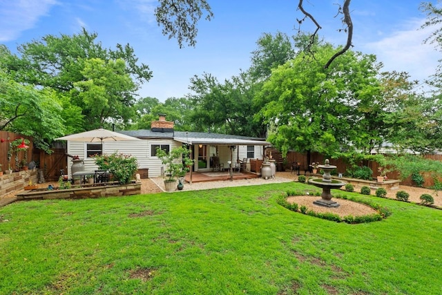 2621 W 45th St, Austin, TX 78731 - back of house featuring a patio and a chimney