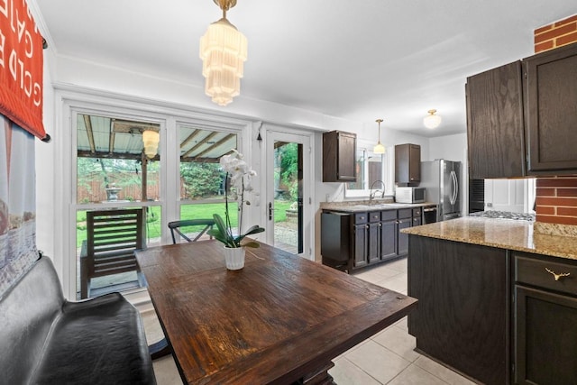 2621 W 45th St, Austin, TX 78731 - dining room with light tile patterned floors